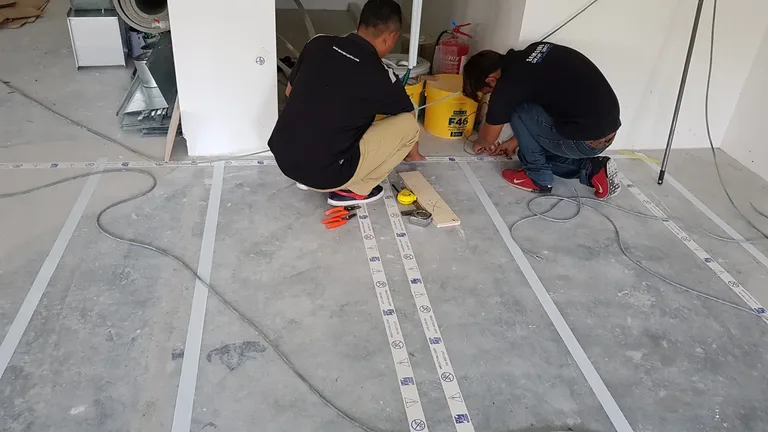 PNSS technicians installing a hearing-loop system at a higher-education facility in Johor